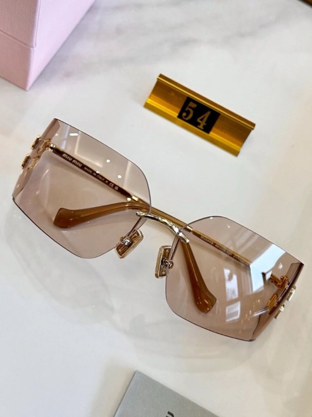 Miu Miu Rimless Sunglasses with Pink-Brown Lenses and Gold Accents - Picture 2 of 7